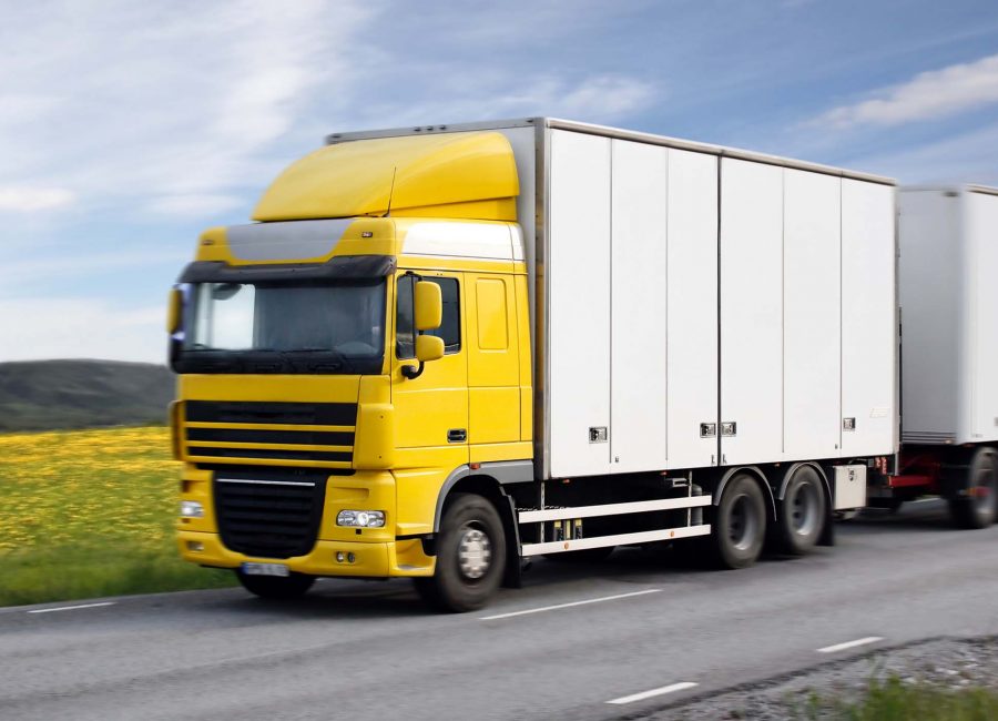 Photo of a truck driving on country-road